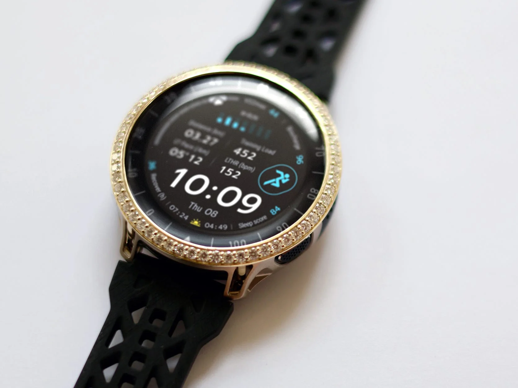 Stylish black smartwatch with a round face displaying the time and fitness metrics.