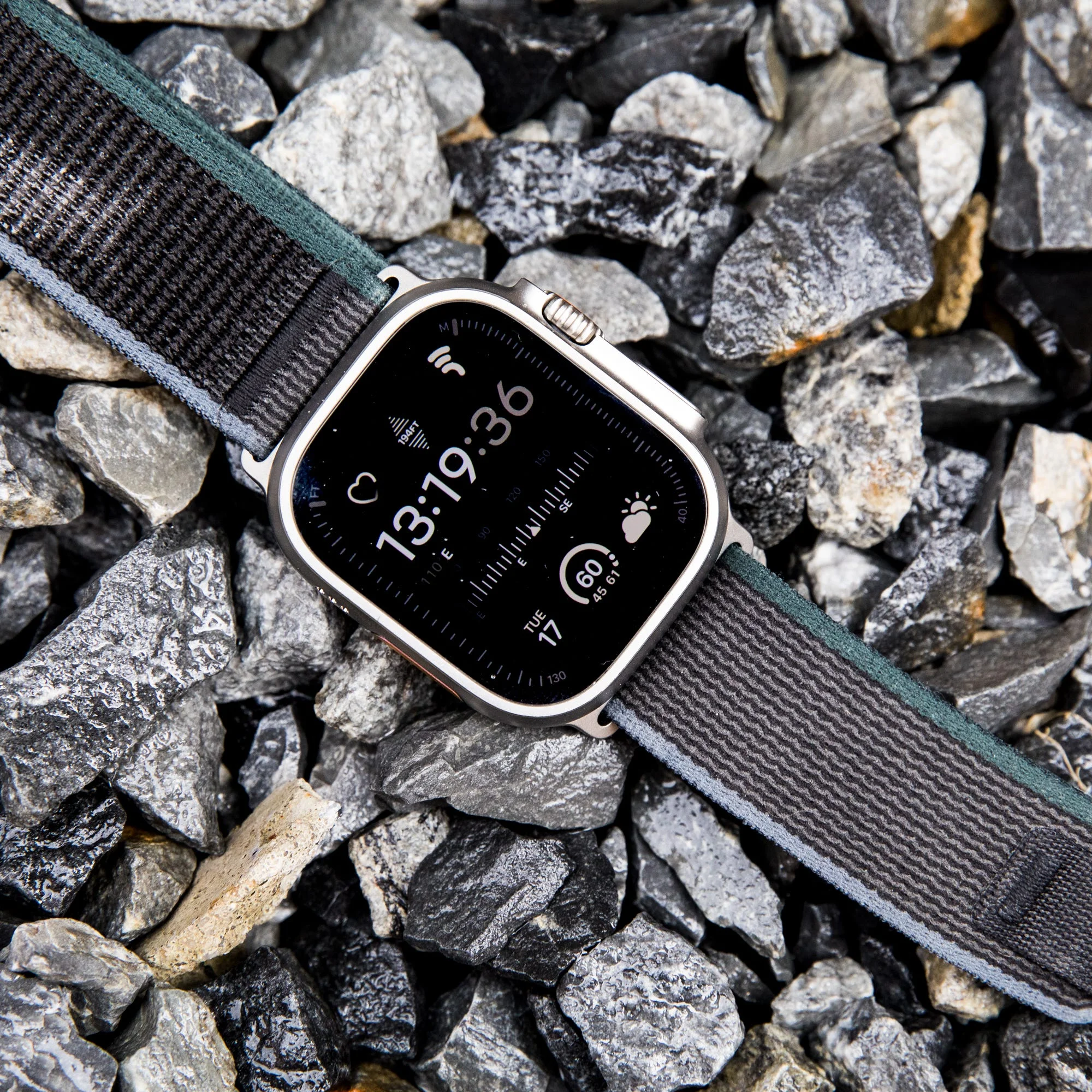 a watch on a pile of rocks
