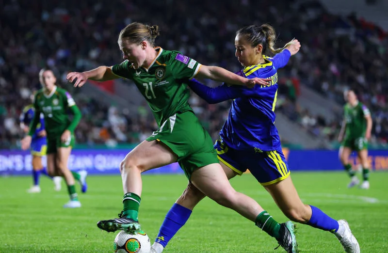 Ireland's Emily Murphy is tackled by Bibigul Nurusheva of Kazakhstan.