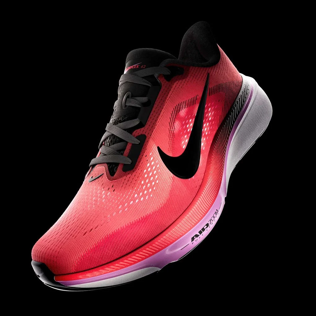 A vibrant pair of Nike running shoes alongside a woman in motion, showcasing athletic wear in a dynamic pose.