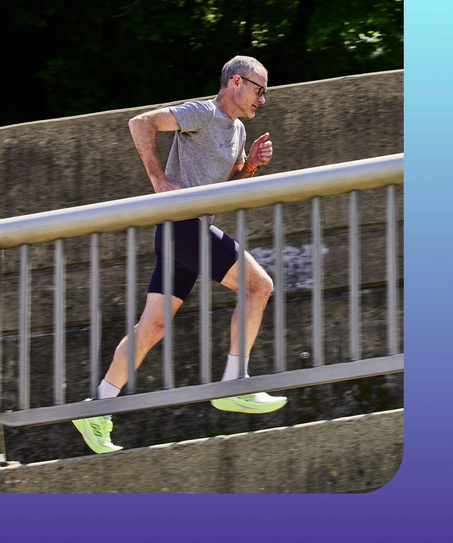 Runner in motion on a path beside a railing. Runner in motion on a path beside a railing.